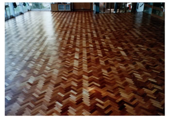 Wood floor sanding in Presdales School, Hertfordshire. Herringbone floorboard sanding in Hertfordshire..