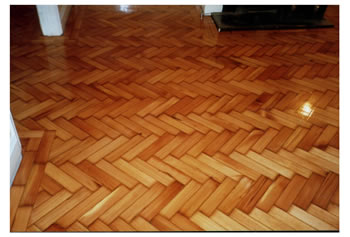 Reclaimed wood floors, installed and finished in Saffron Walden. Reclaimed pine wood block flooring in herringbone pattern, cleaned, installed, sanded and sealed..