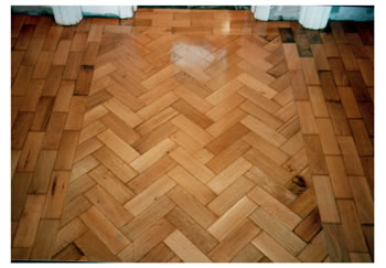 Reclaimed wood floors, installed and finished in Belsize Park, London. Reclaimed wooden blocks from County Hall, installed in herringbone pattern, sanded and sealed..