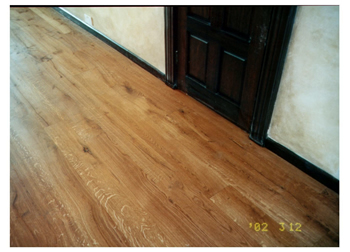 Reclaimed wood floors in Epping, Essex. Reclaimed french oak floorboards, sanded and finished with a teak oil..