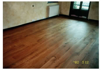 Reclaimed wooden floorboards, installed in Epping, Essex. Reclaimed french oakboards, sanded and finished with a teak oil..