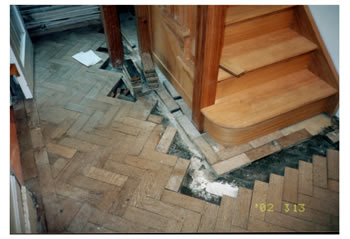 Wood floor repairs and stripping in Sevenoaks, Kent. We made repairs to this oak wood block floor with herringbone pattern..