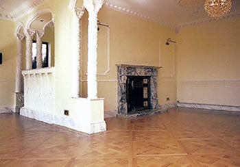 New oak wooden floor installed in Waltham Abbey. We installed this new english oak flooring in a versailles pattern.  We then sanded the floor and finished with an oil.  This wood flooring has a two line border of maple and walnut.  .