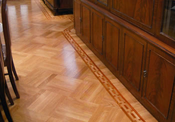 Oak wood floor in basket weave pattern. We installed this new flat sawn european oak in a basket weave pattern with a hand-made mahogany chain border..