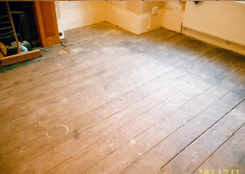 Pine floor board stripping in Watford. We stripped and sanded these existing pine floorboards..